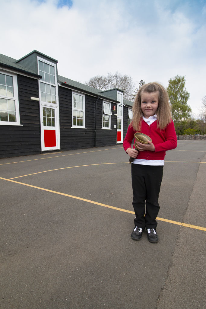 Child with school bell